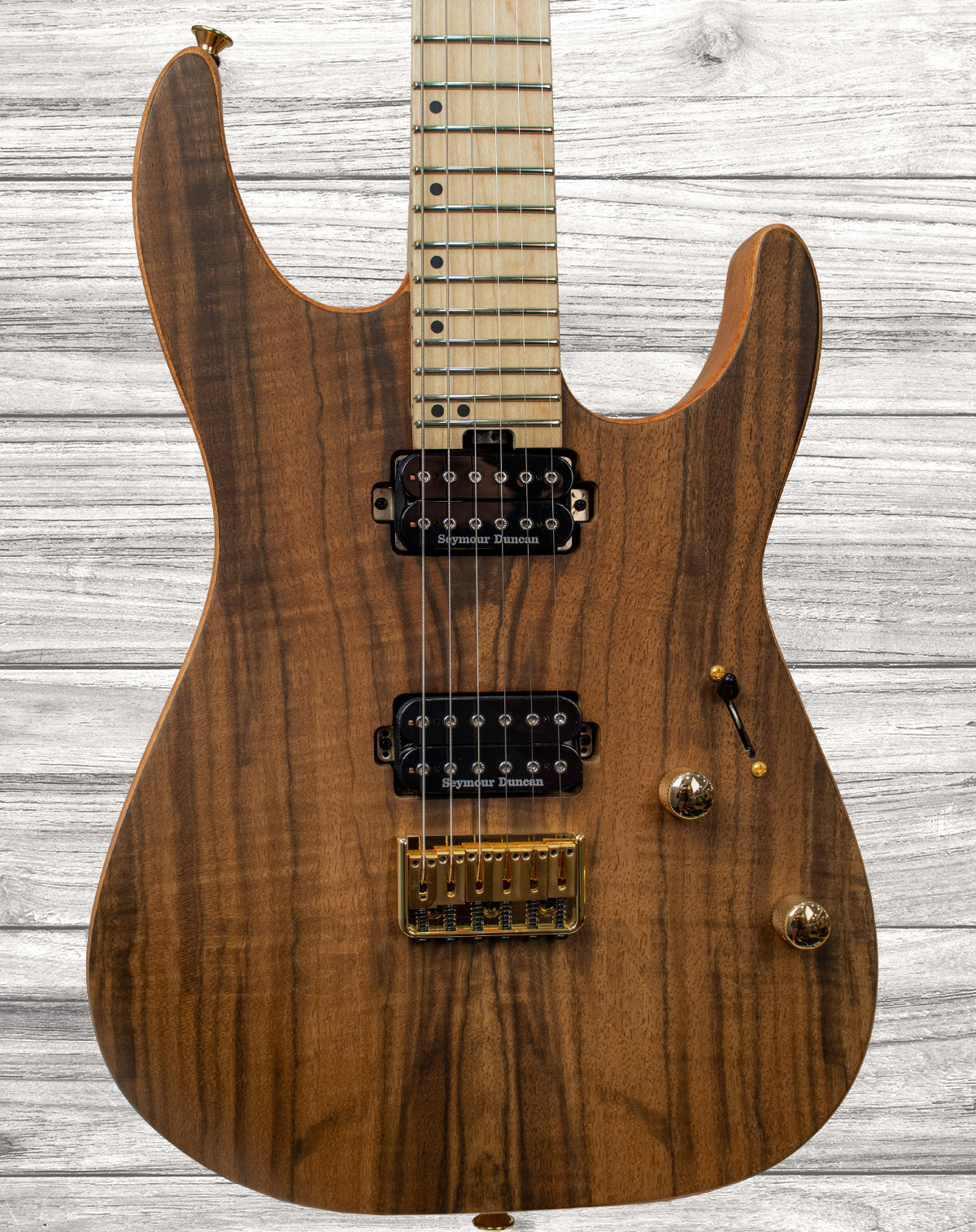 charvel-pro-mod-dk24-hh-ht-m-figured-walnut-natural_5f19ac7e8aeeb.jpg