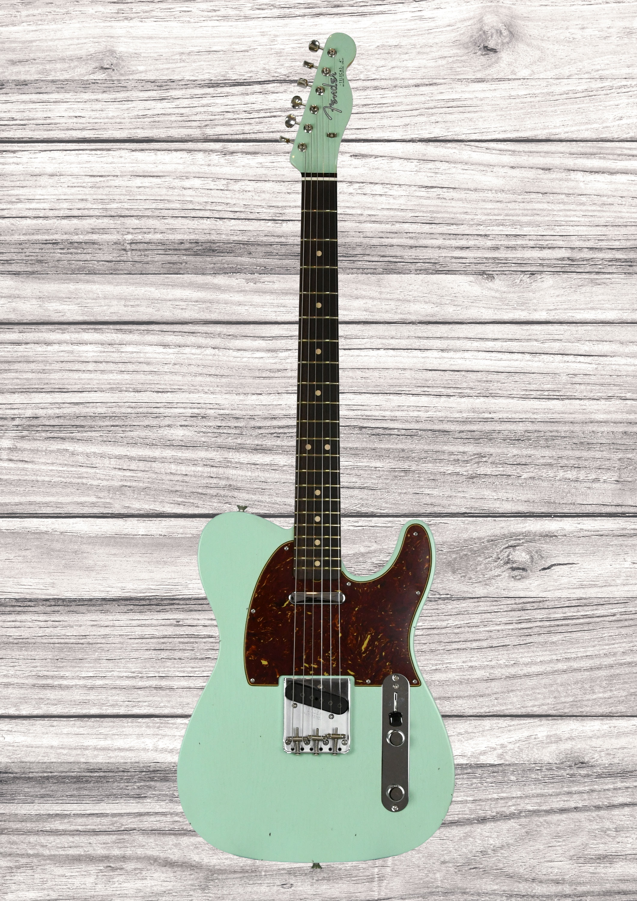 fender-custom-shop-1963-telecaster-journeyman-relic-aged-surf-green_6a3d2f697f82e.jpg