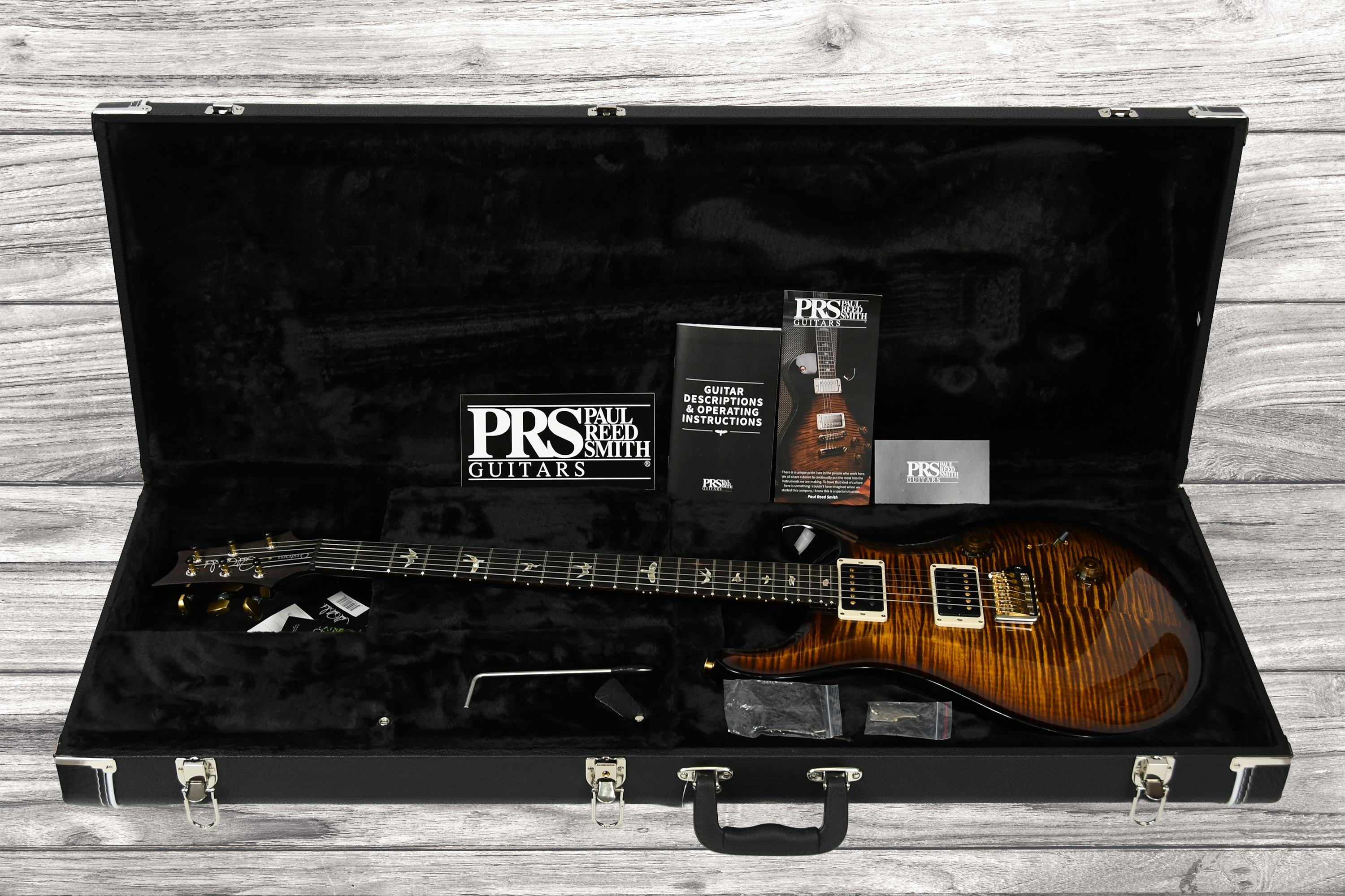 prs-custom-24-10-black-gold-burst_68fa469047fda.jpg